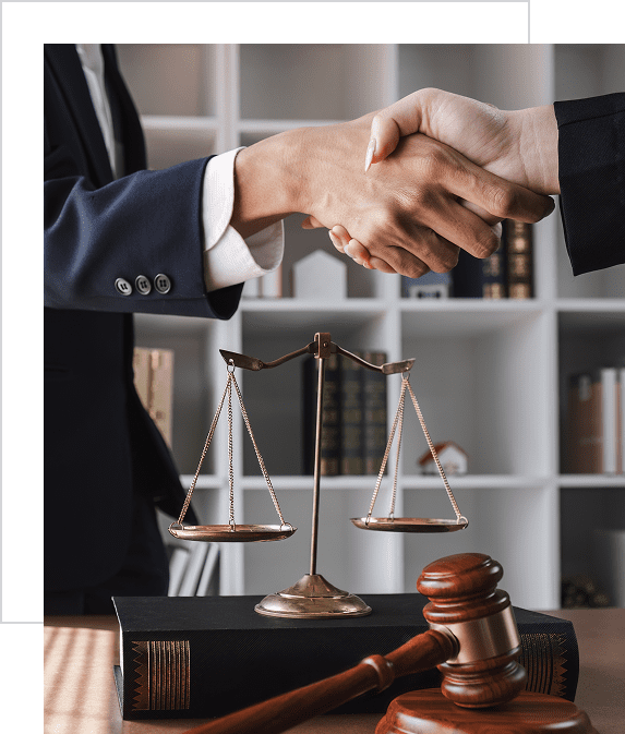 Lawyers shaking hands in office