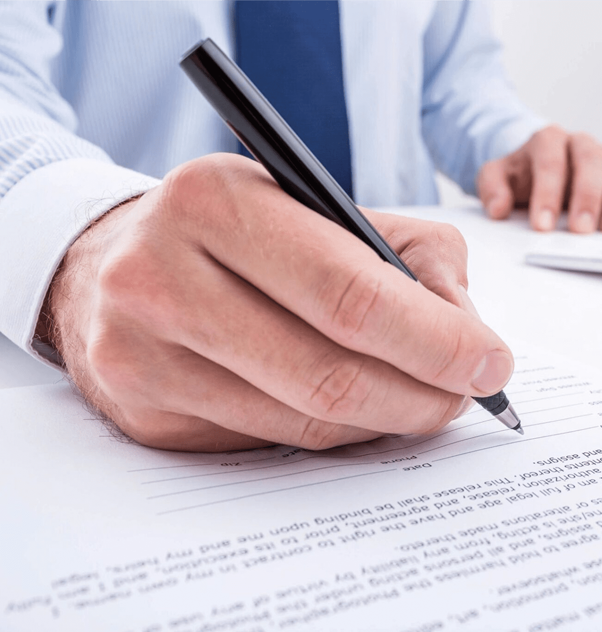 Businessman writing on paper