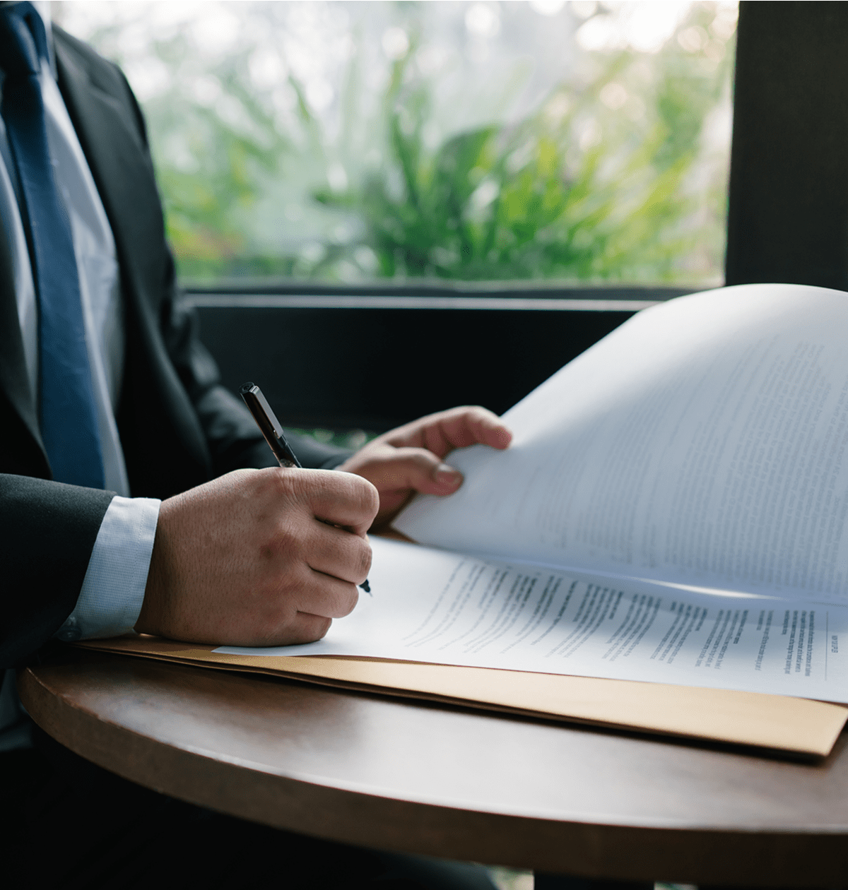 Professional reading contract at office table