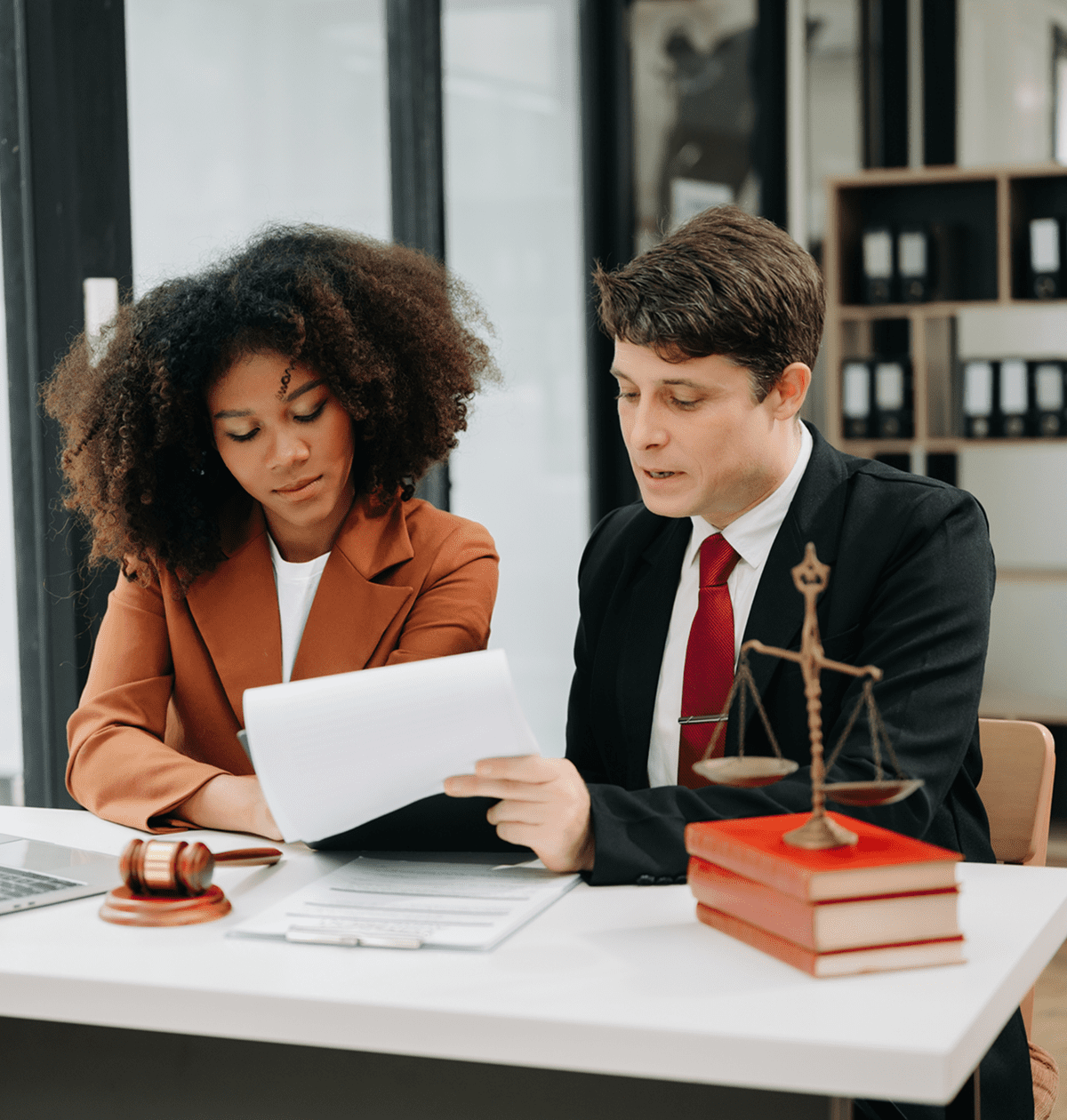 Legal professionals reviewing paperwork together