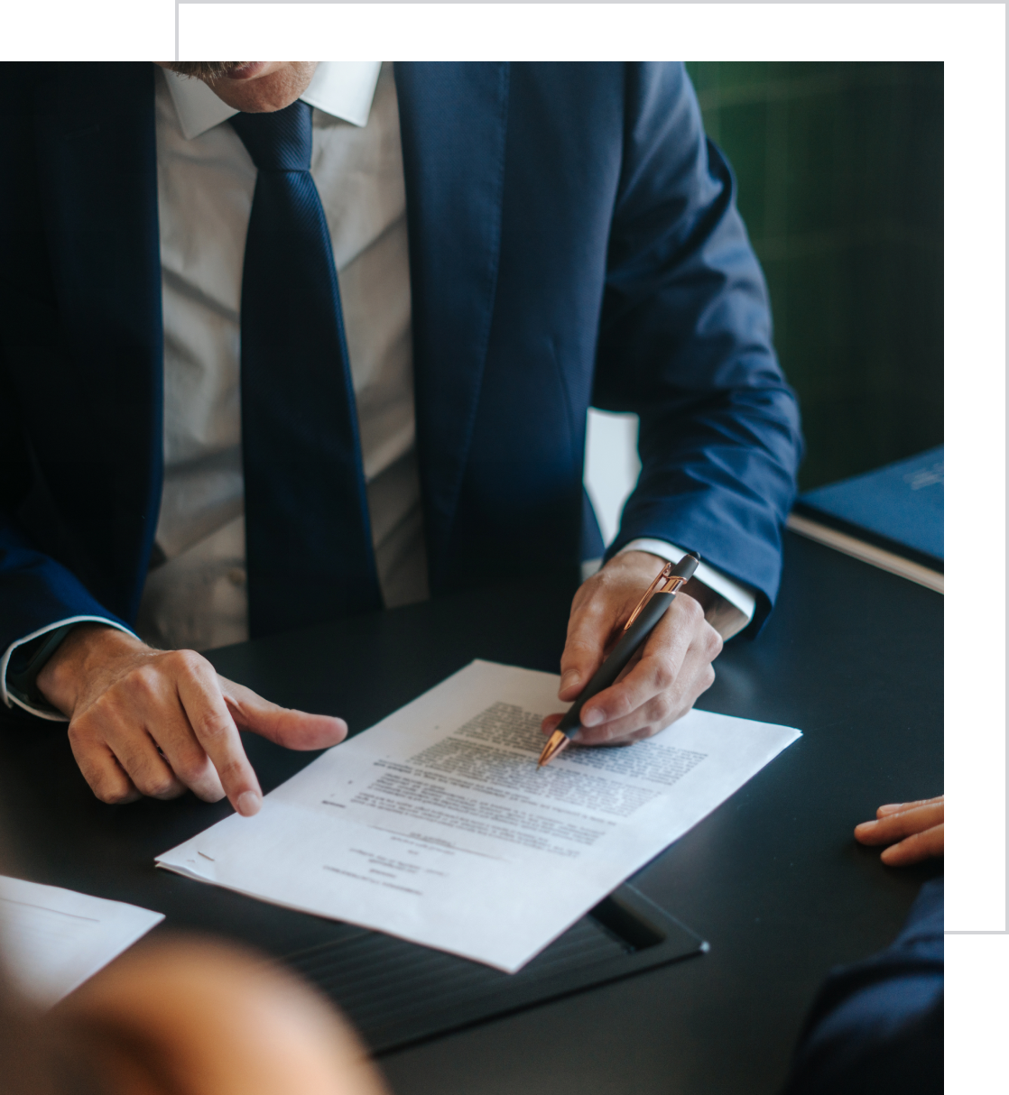 Man signing a legal agreement
